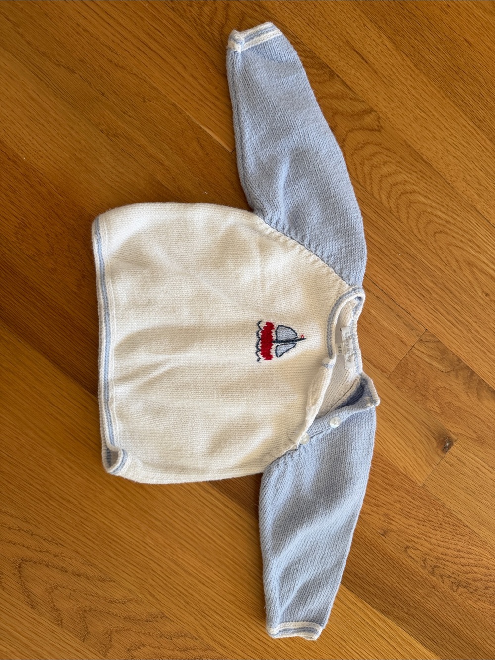 Kissy Kissy Cream Knit Top with Light Blue Sleeves and Sailboat Motif